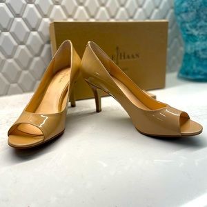 Cole Haan nude patent peep toe shoes.